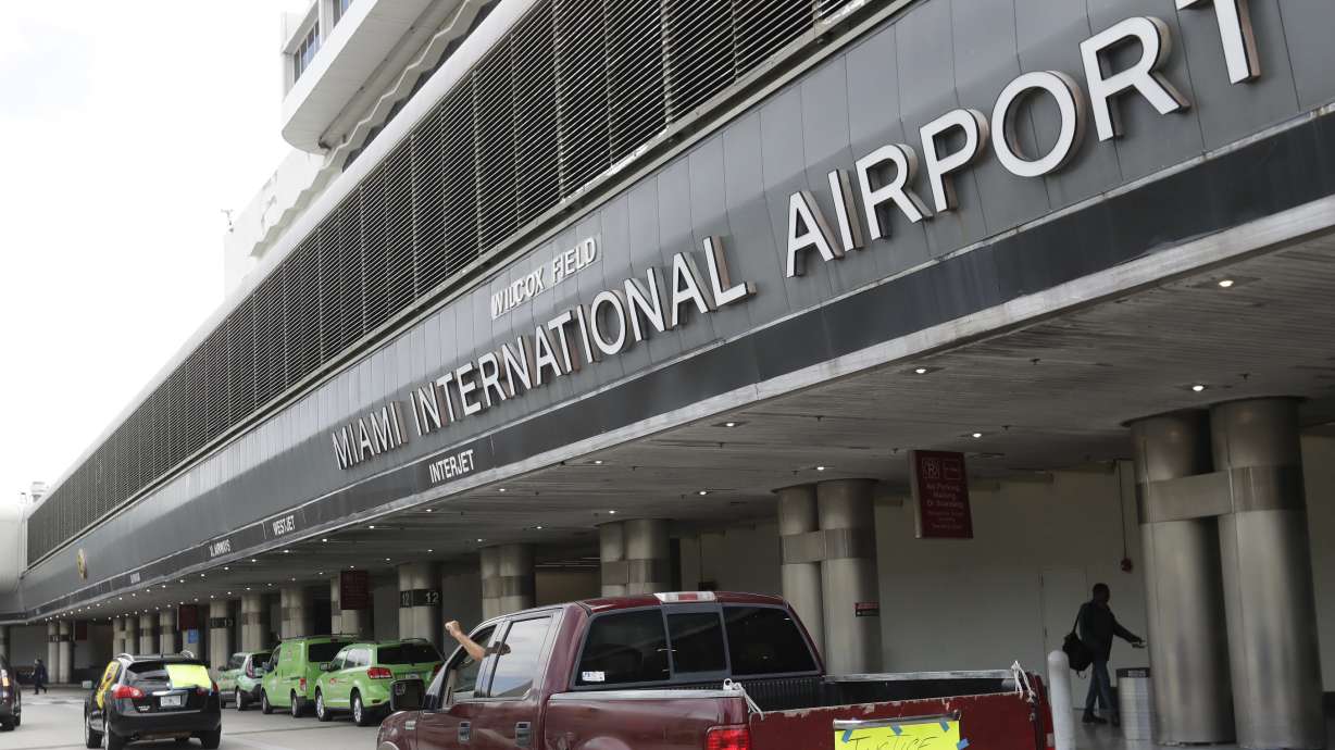 Court records say a passenger on a small regional flight to Miami attacked a flight attendant and swallowed rosary beads as pilots returned to the airport in Savannah, Georgia.