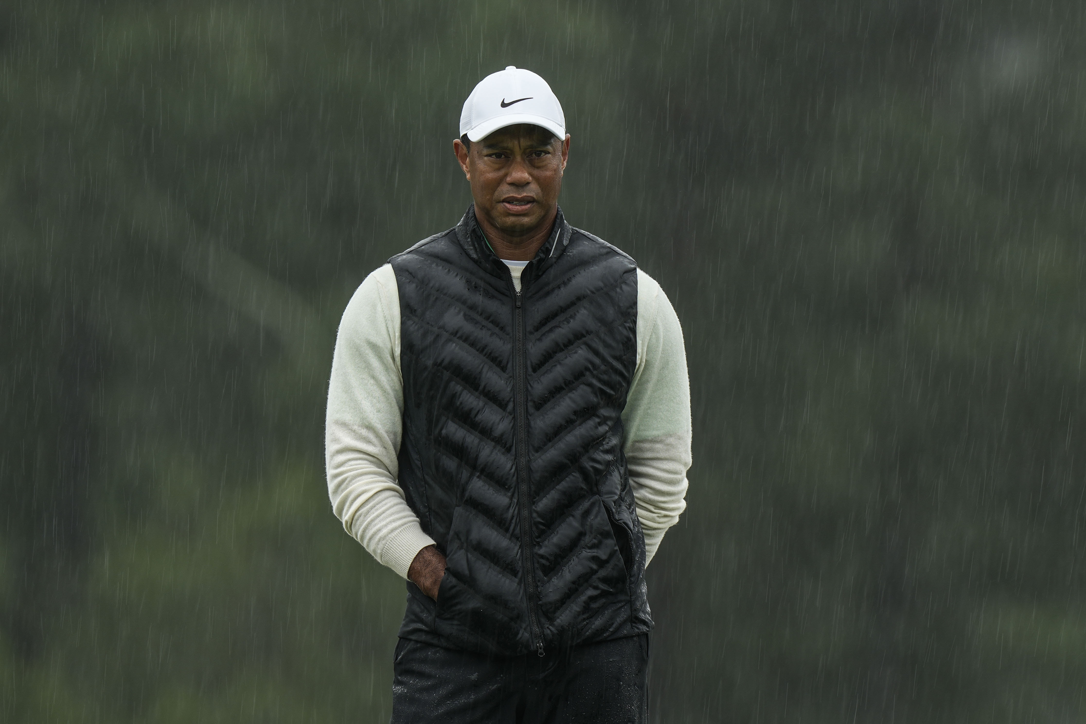 FILE - Tiger Woods walks on the 18th hole during the weather delayed second round of the Masters golf tournament at Augusta National Golf Club on April 8, 2023, in Augusta, Ga.