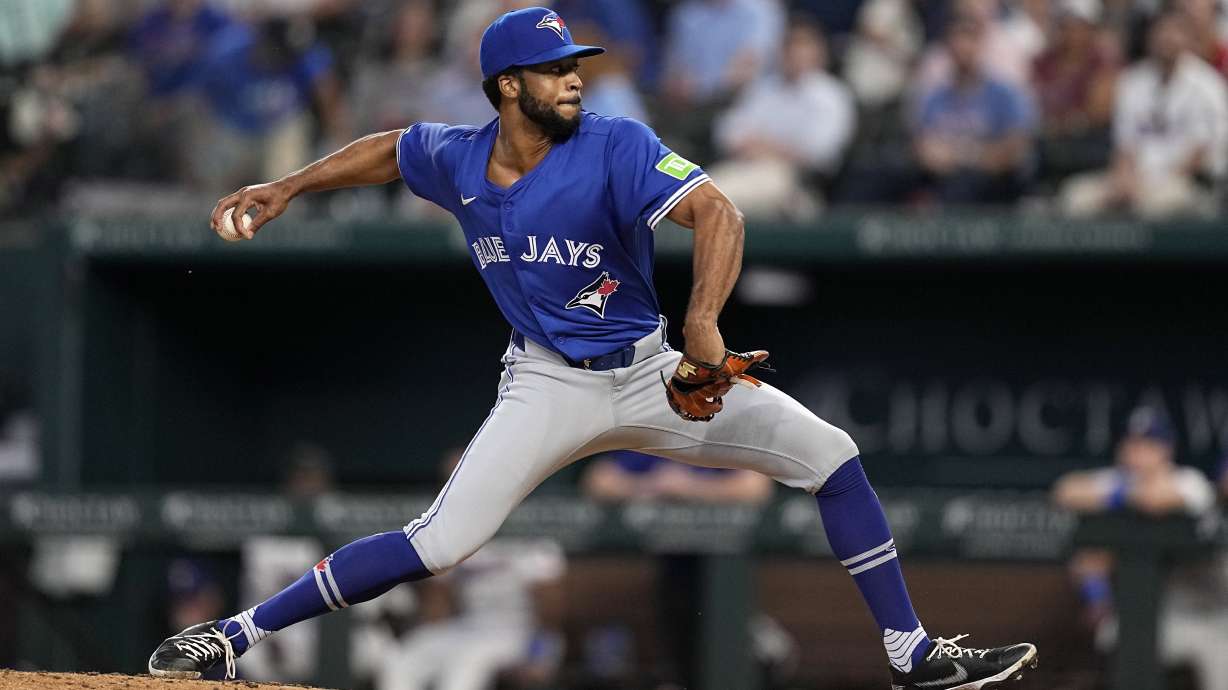 FILE - Toronto Blue Jays relief pitcher Dillon Tate throws to the Texas Rangers in the sixth inning of a baseball game in Arlington, Texas, Sept. 19, 2024.