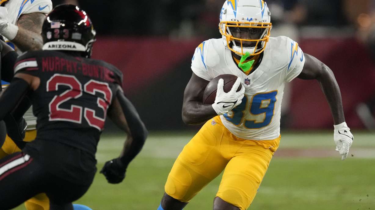 FILE - Los Angeles Chargers wide receiver Jalen Reagor (89) runs from Arizona Cardinals cornerback Sean Murphy-Bunting (23) after catching a pass during the first half of an NFL football game, Monday, Oct. 21, 2024, in Glendale Ariz.