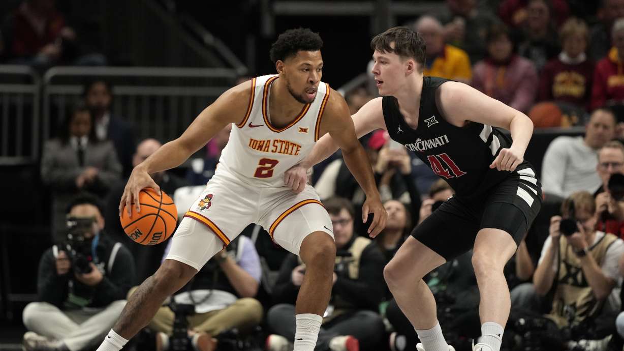 Iowa State's Joshua Jefferson (2) dribbles around Cincinnati's Simas Lukosius (41) during the first half of an NCAA college basketball game in the second round of the Big 12 Conference tournament, Wednesday, March 12, 2025, in Kansas City, Mo.
