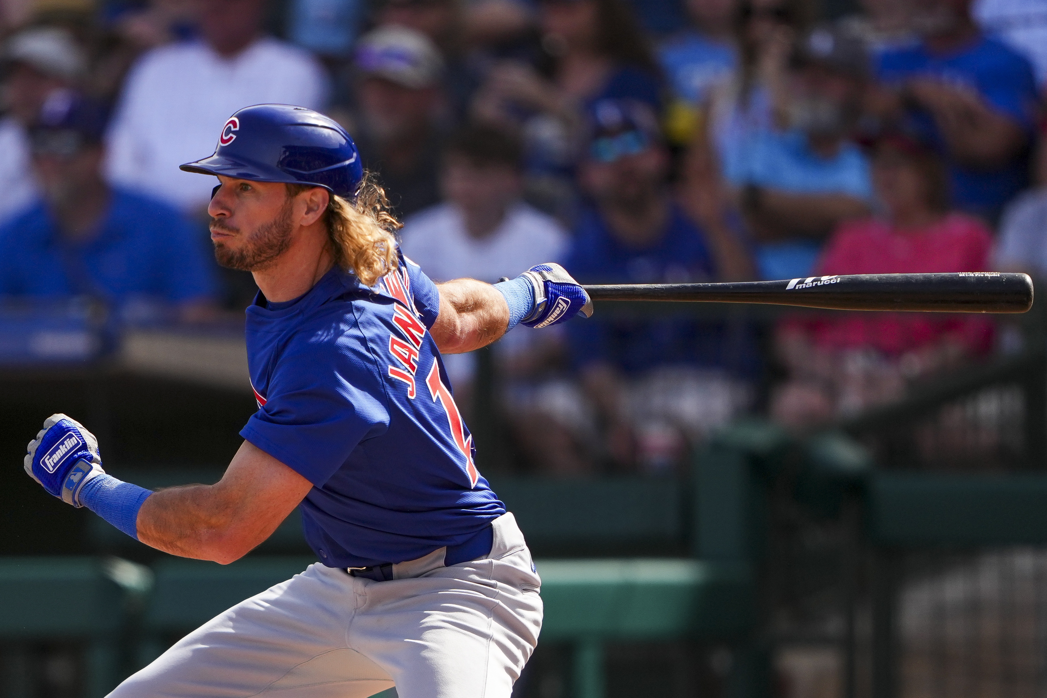 FILE - Chicago Cubs' Travis Jankowski follows through on a single against the Texas Rangers during the fourth inning of a spring training baseball game Friday, Feb. 28, 2025, in Surprise, Ariz.