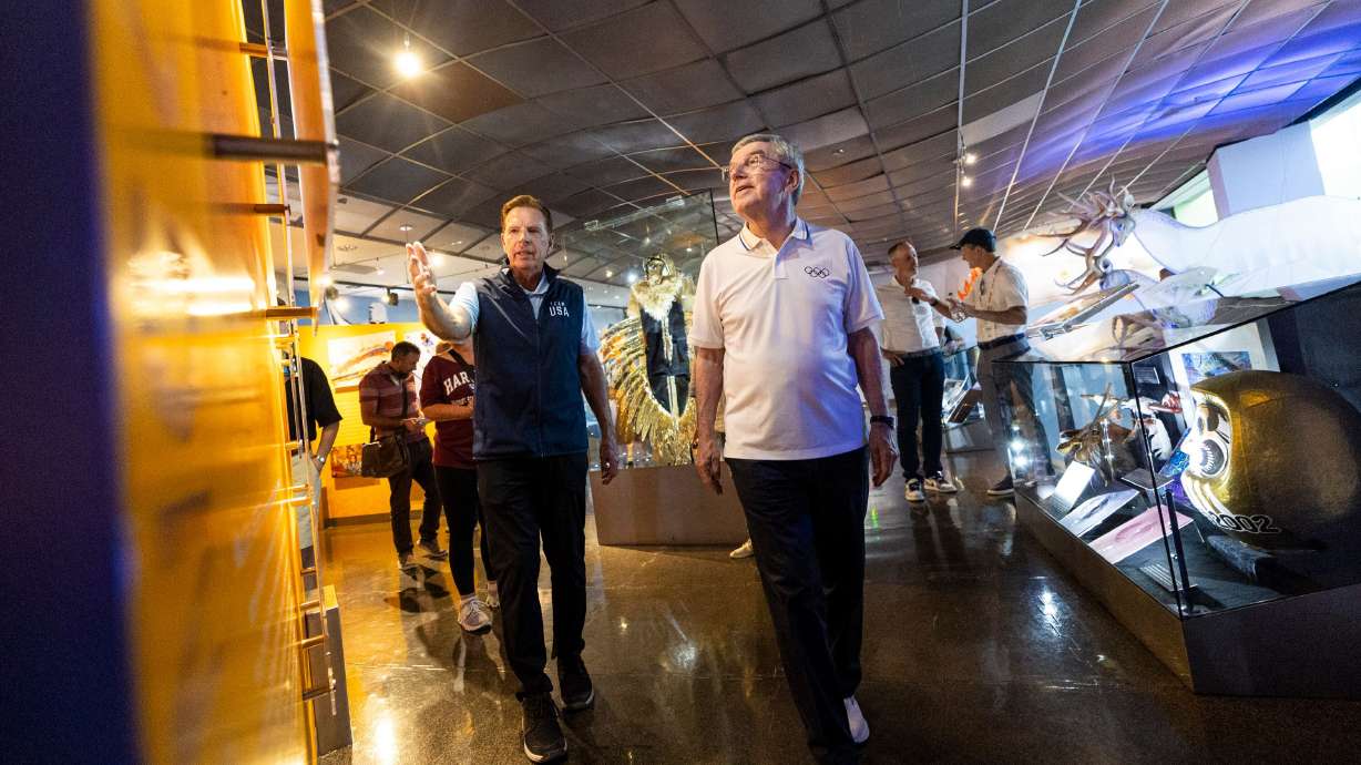 Salt Lake City-Utah 2034 President and CEO Fraser Bullock shows International Olympic Committee President Thomas Bach around the 2002 Olympic and Paralympic Museum in Park City on Sept. 28. 2024.