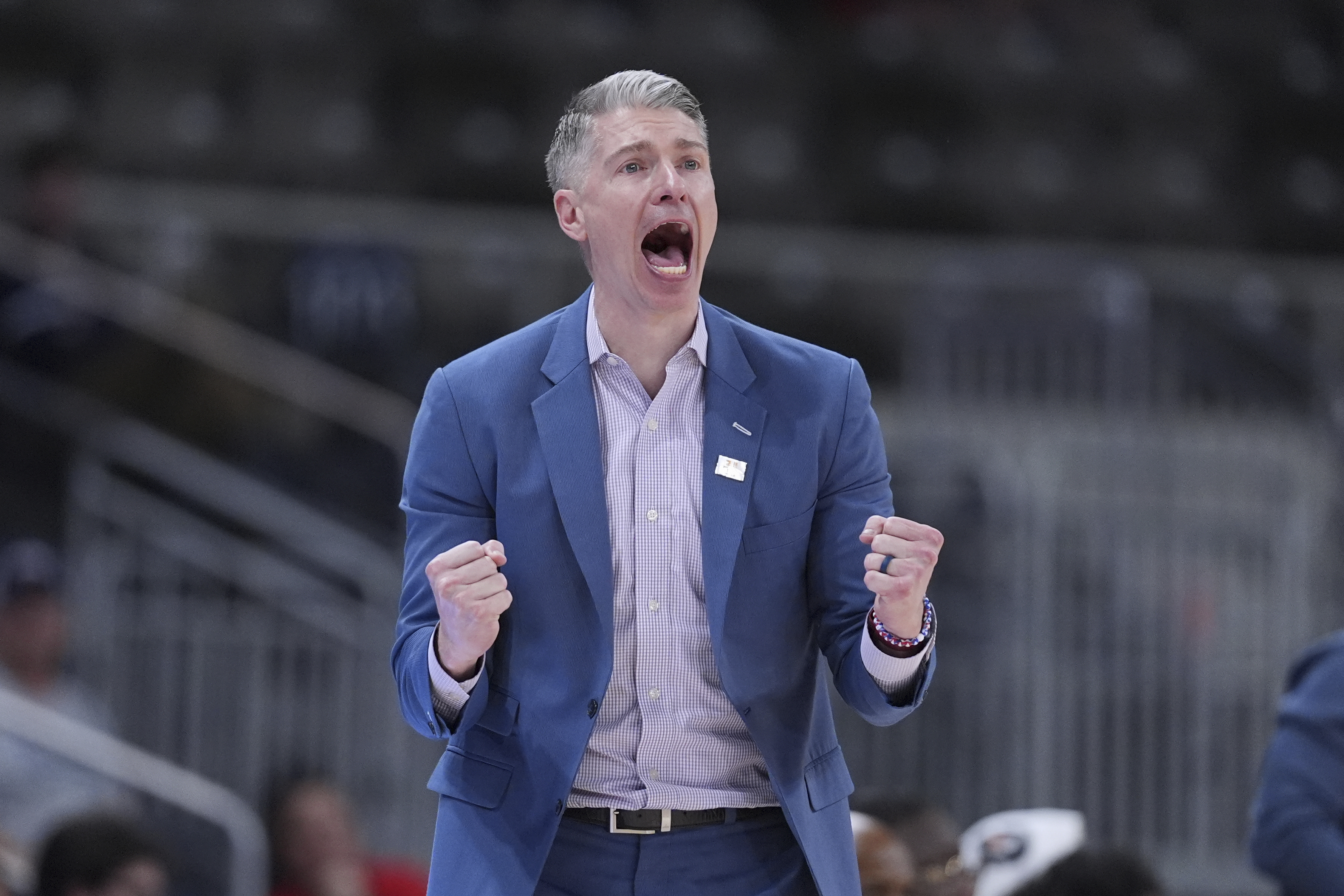 Robert Morris head coach Andrew Toole celebrates in the second half of an NCAA college basketball game in the championship of the Horizon League tournament against Youngstown State in Indianapolis, Tuesday, March 11, 2025. 
