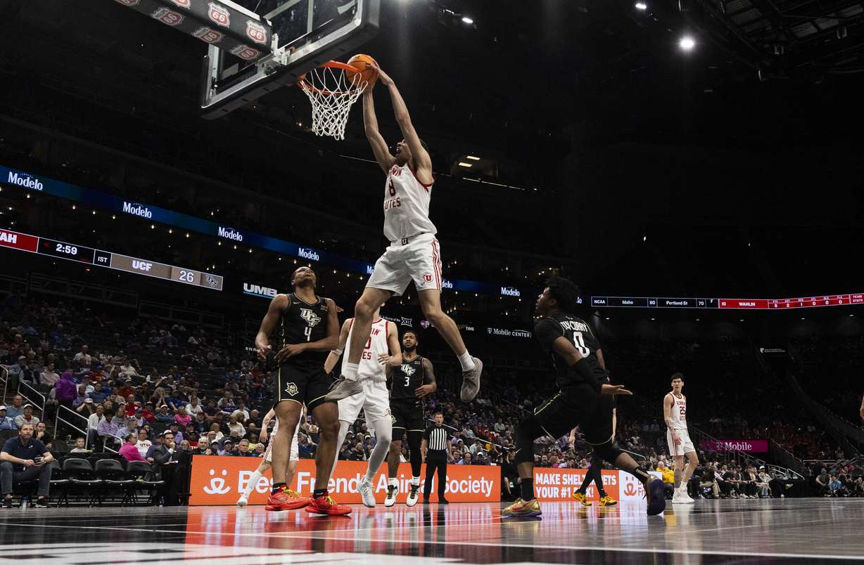 Utah Utes forward Keanu Dawes (8) dunks the ball during a first round game of the Big 12 Championship between the Utah Utes and the UCF Knights at the T-Mobile Center in Kansas City, Missouri, on Tuesday, March 11, 2025. The Utah Utes were knocked out of the championship by the UCF Knights, with a final score of 87-72.