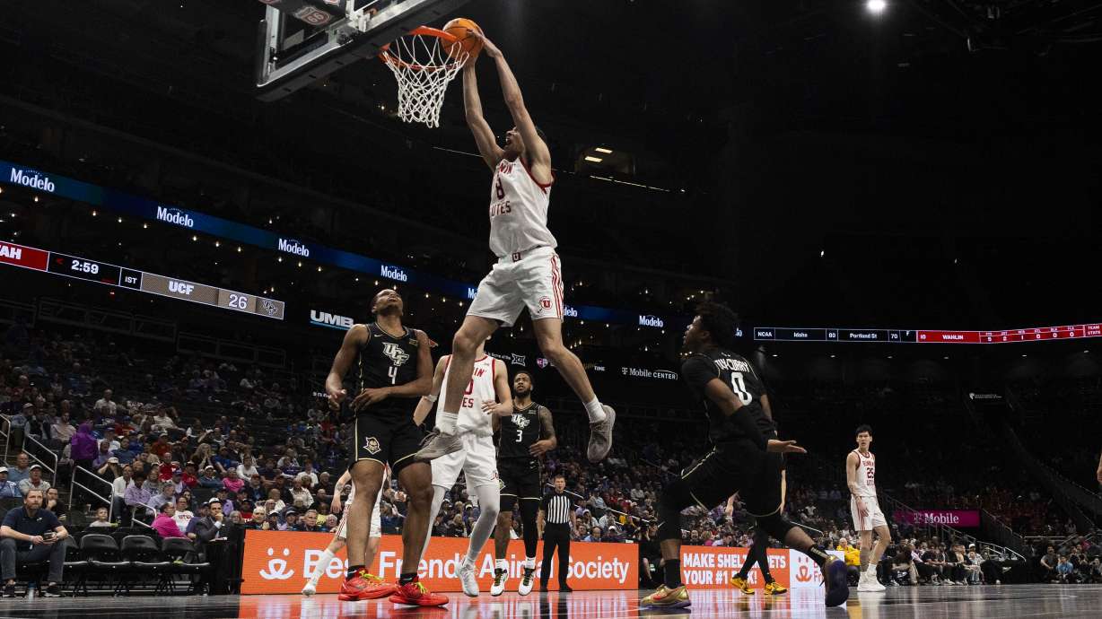 Utah Utes forward Keanu Dawes (8) dunks the ball during a first round game of the Big 12 Championship between the Utah Utes and the UCF Knights at the T-Mobile Center in Kansas City, Missouri, on Tuesday, March 11, 2025. The Utah Utes were knocked out of the championship by the UCF Knights, with a final score of 87-72.