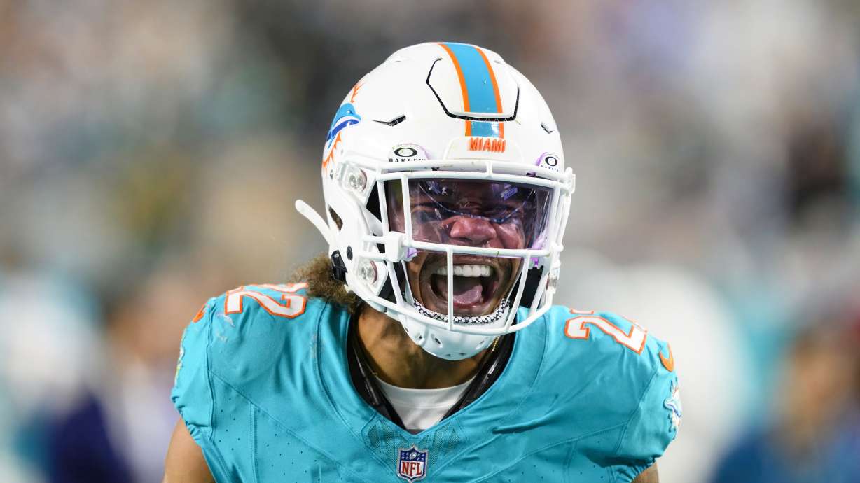 FILE - Miami Dolphins defensive back Elijah Campbell (22) reacts as he celebrates recovering a fumble during an NFL football game against the Tennessee Titans Monday, Dec. 12, 2023, in Miami Gardens, Fla.