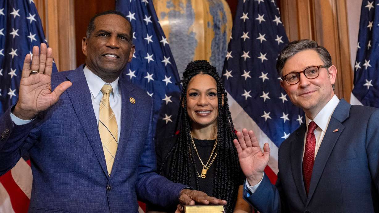 House Speaker Mike Johnson, R-La., performs the ceremonial swearing-in with Rep. Burgess Owens, R-Utah, in the Rayburn Room at the Capitol in Washington, Jan. 3. Owens is hoping to "modernize" distance education funding policies at for-profit colleges.