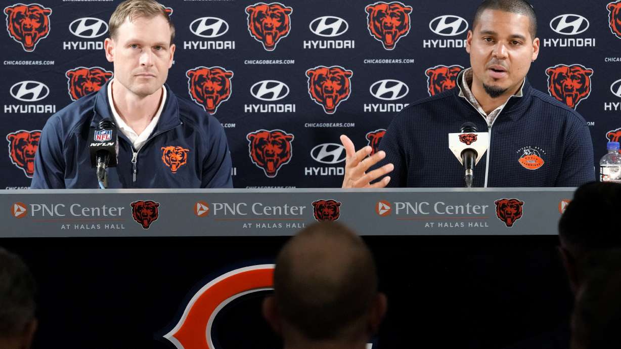 Chicago Bears general manager Ryan Poles, right, talks to media as new head coach Ben Johnson listens to him during a news conference at Halas Hall in Lake Forest, Ill., Wednesday, March 12, 2025.