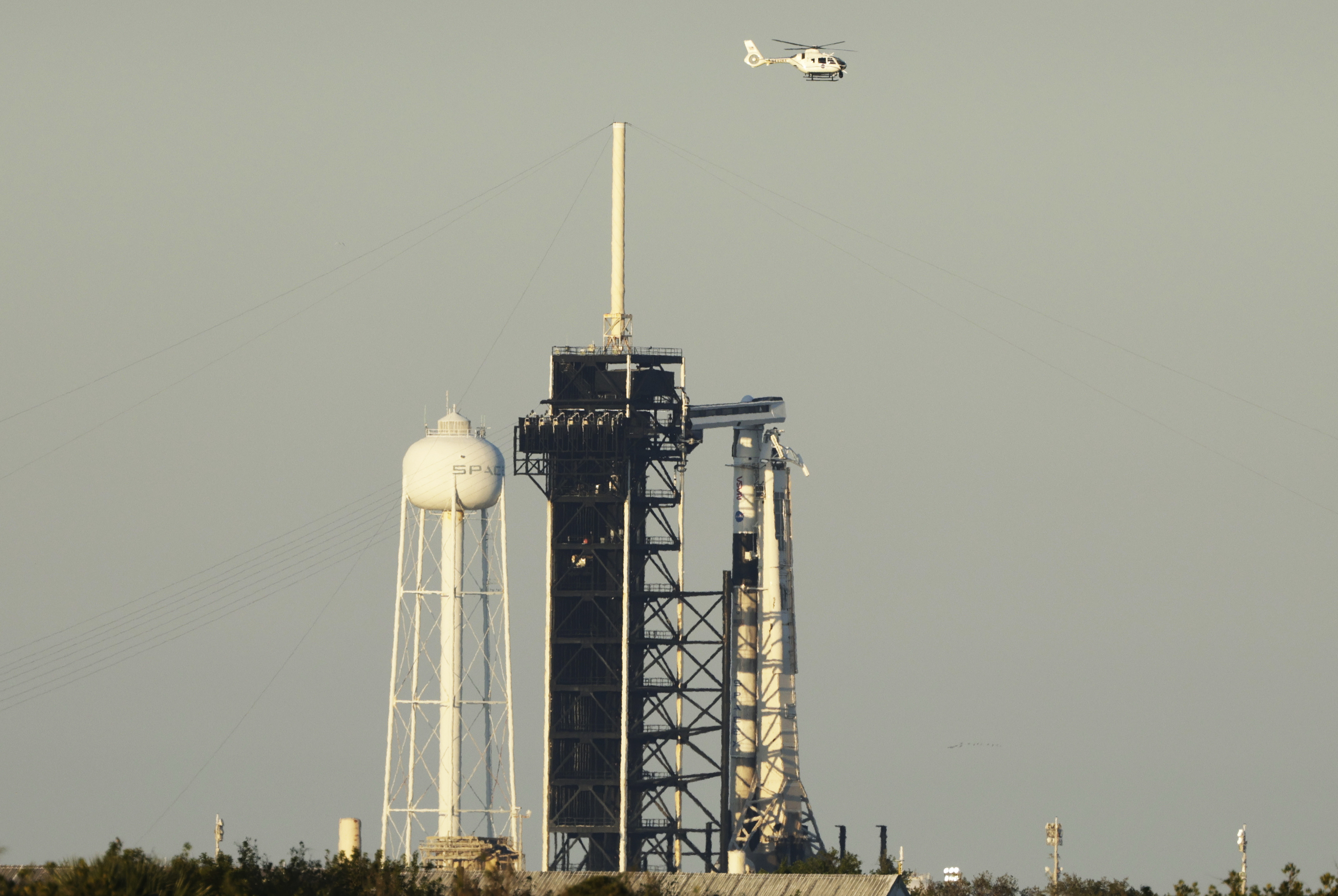 A SpaceX Falcon 9 rocket with a crew of four aboard the Crew Dragon spacecraft scrubbed prior to liftoff for a mission to the International Space Station in Cape Canaveral, Fla., Wednesday.