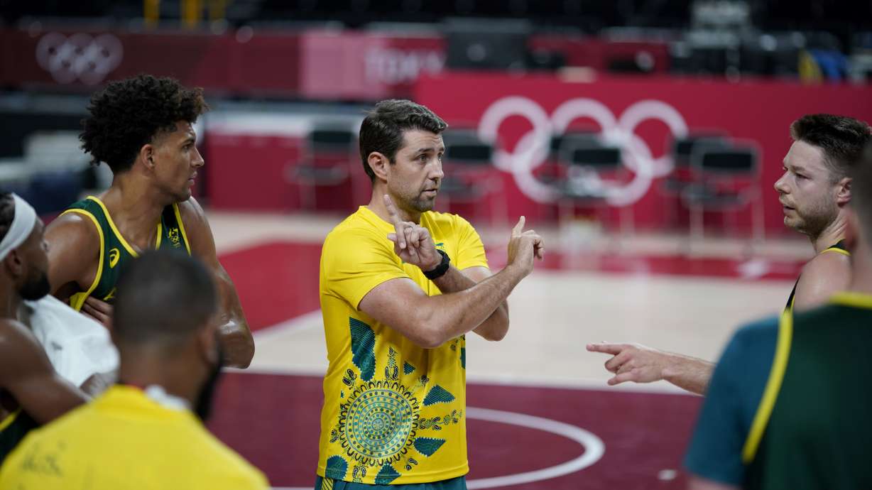 FILE - Australia assistant coach Adam Caporn talks to players during a men's basketball practice at the Tokyo 2020 Olympics, in Saitama, Japan, Thursday, July 22, 2021.