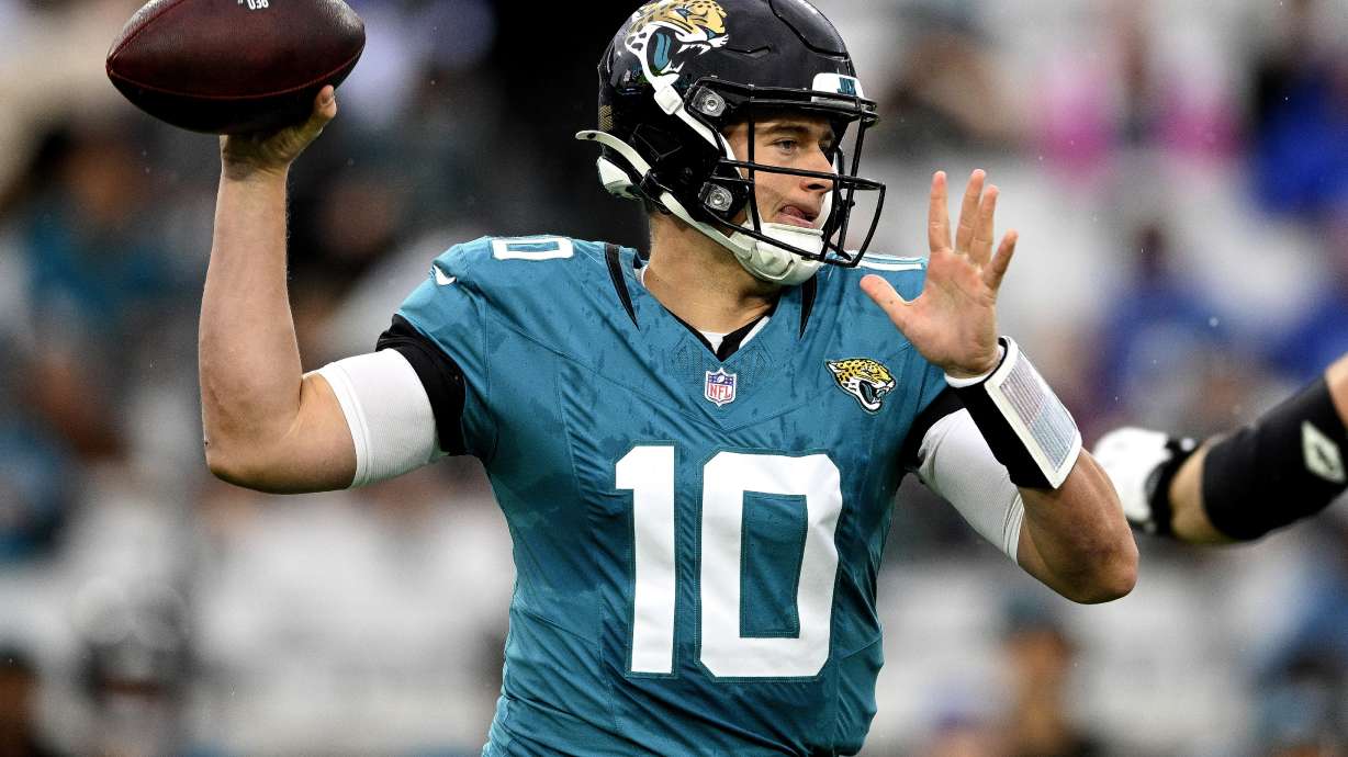 FILE - Jacksonville Jaguars quarterback Mac Jones (10) looks to throw a pass during the first half of an NFL football game against the Tennessee Titans, Sunday, Dec. 29, 2024, in Jacksonville, Fla.