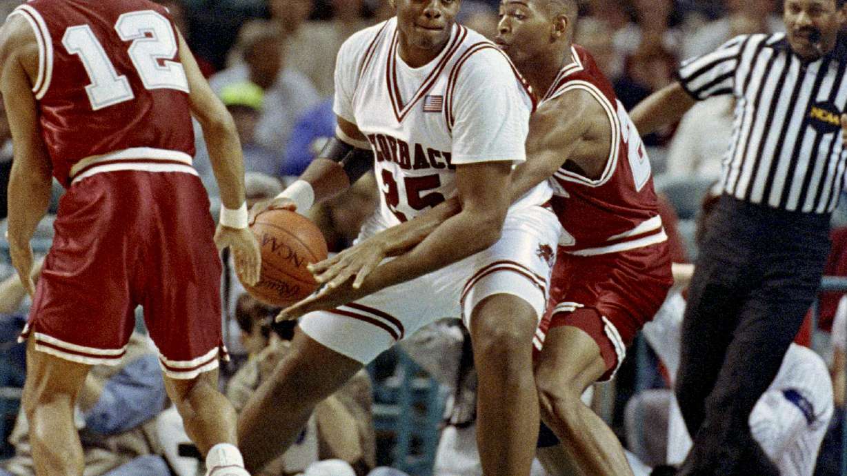 FILE - Arkansas' Oliver Miller (25) drives to the basket during first half action in the NCAA Southeast Regional at the Charlotte Coliseum in N.C., March 21, 1991.