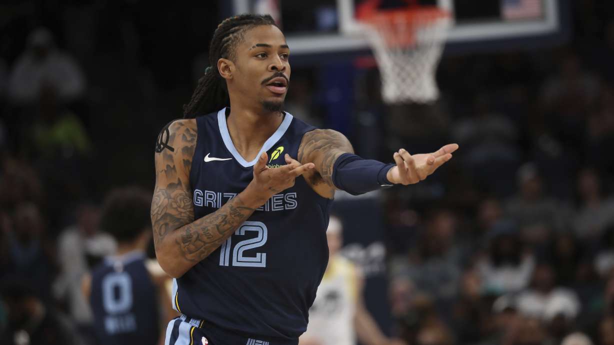 Memphis Grizzlies guard Ja Morant (12) celebrates in the first half of an NBA basketball game against the Utah Jazz, Wednesday, March 12, 2025, in Memphis, Tenn.