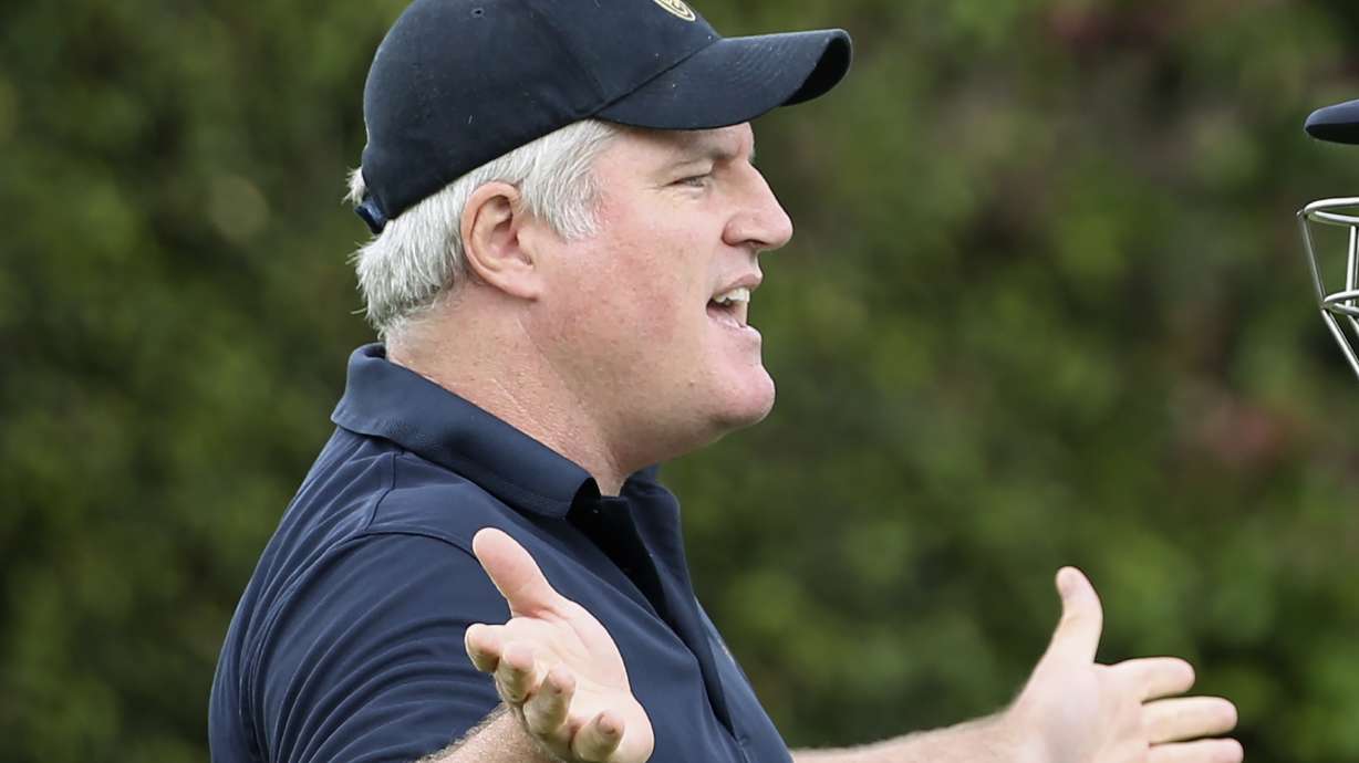 FILE - In this Jan. 3, 2018, file photo, former Australian spin bowler Stuart MacGill helps England's team while training for their cricket test match against Australia in Sydney.
