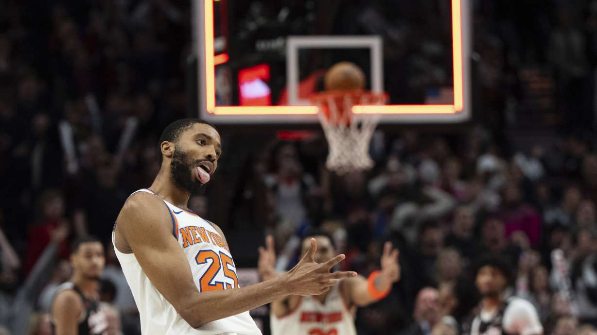 New York Knicks forward Mikal Bridges (25) celebrates after making the game-winning shot in overtime during an NBA basketball game against the Portland Trail Blazers, Wednesday, March 12, 2025, in Portland, Ore.