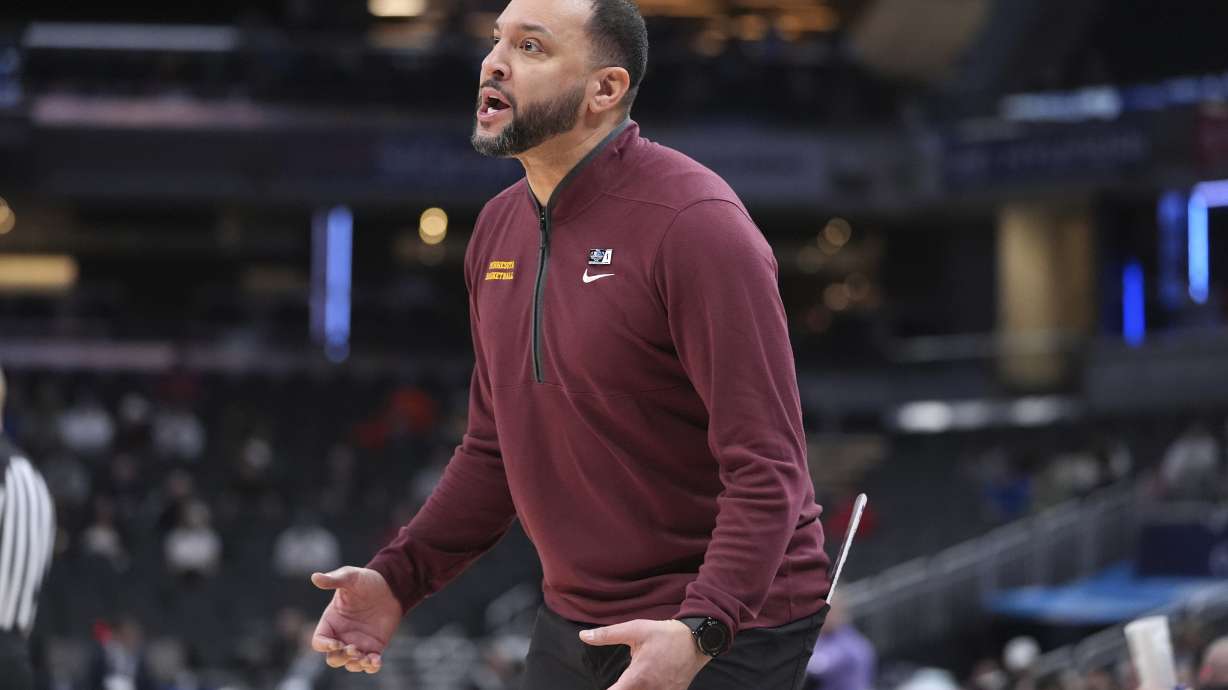 Minnesota head coach Ben Johnson watches against Northwestern during the first half of an NCAA college basketball game in the first round of the Big Ten Conference tournament in Indianapolis, Wednesday, March 12, 2025.