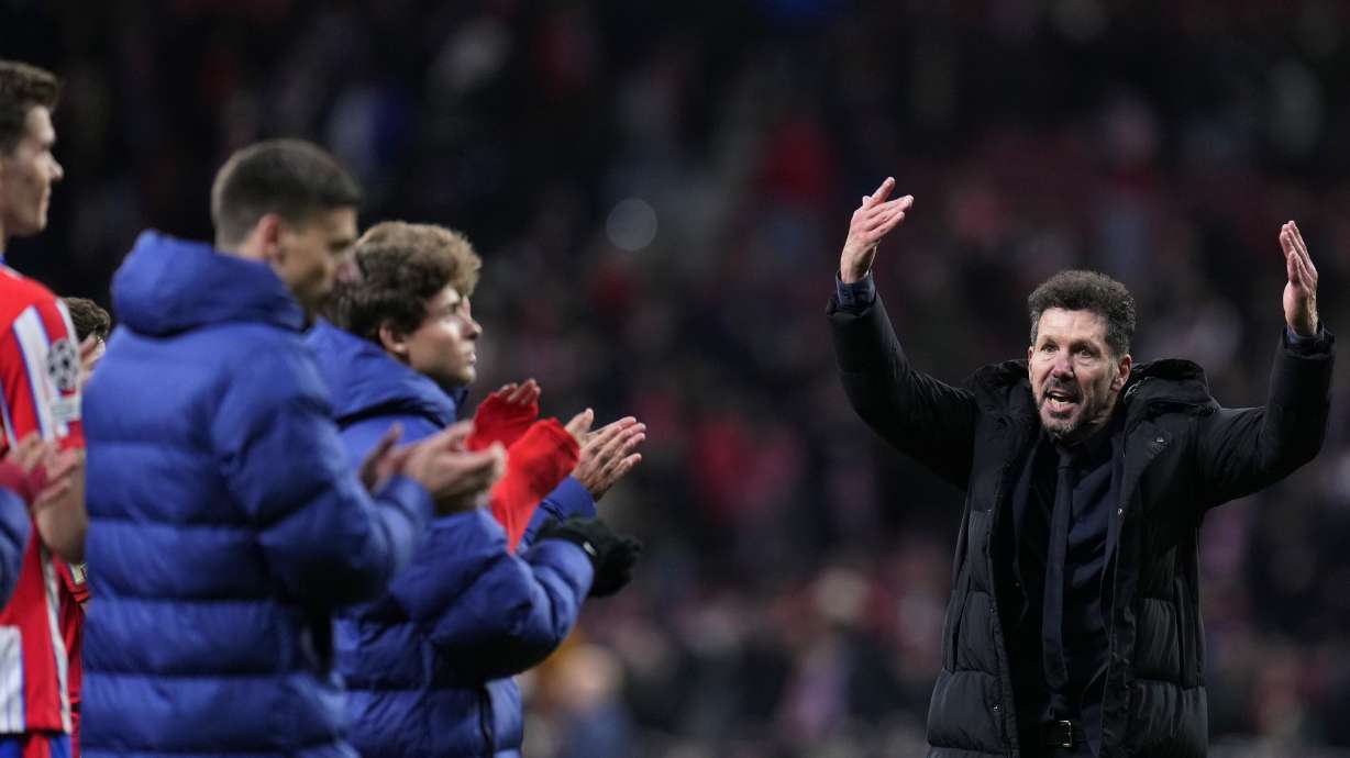 Atletico Madrid's head coach Diego Simeone gestures while te players applaud the fans at the end of the Champions League round of 16, second leg, soccer match between Atletico Madrid and Real Madrid at the Metropolitano stadium in Madrid, Spain, Wednesday, March 12, 2025.