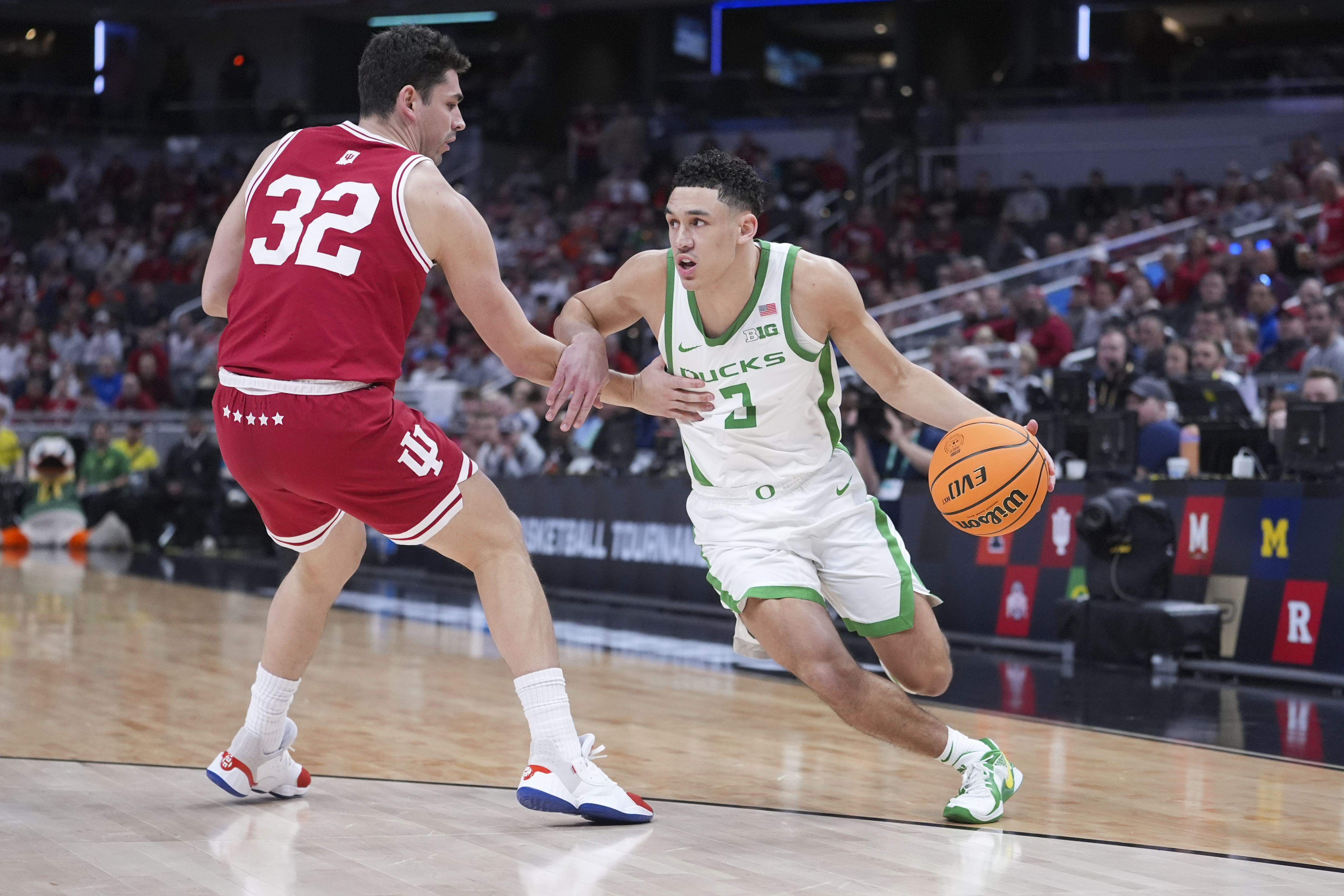 Oregon guard Jackson Shelstad (3) drives on Indiana guard Trey Galloway (32) during the first half of an NCAA college basketball game in the second round of the Big Ten Conference tournament in Indianapolis, Thursday, March 13, 2025.