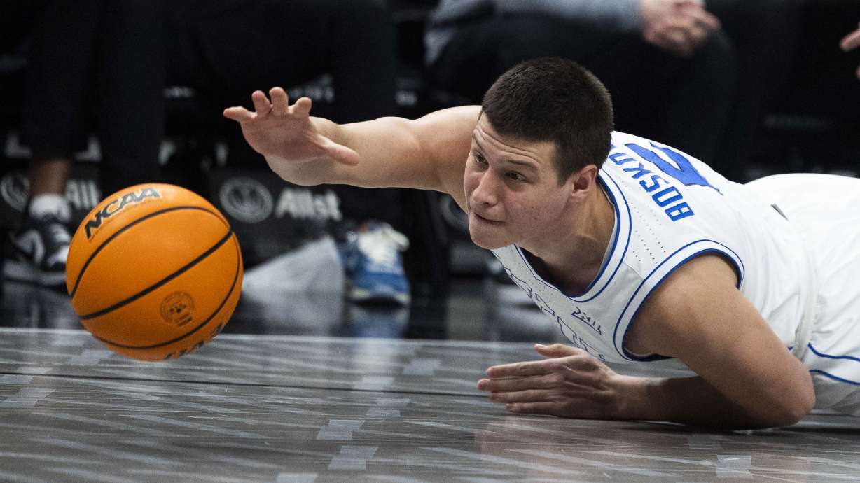 Brigham Young Cougars forward Mihailo Boskovic (5) reaches for a loose ball during a quarterfinals game between BYU and the Iowa State Cyclones at the Big 12 Championship at the T-Mobile Center in Kansas City, Missouri, on Thursday, March 13, 2025.