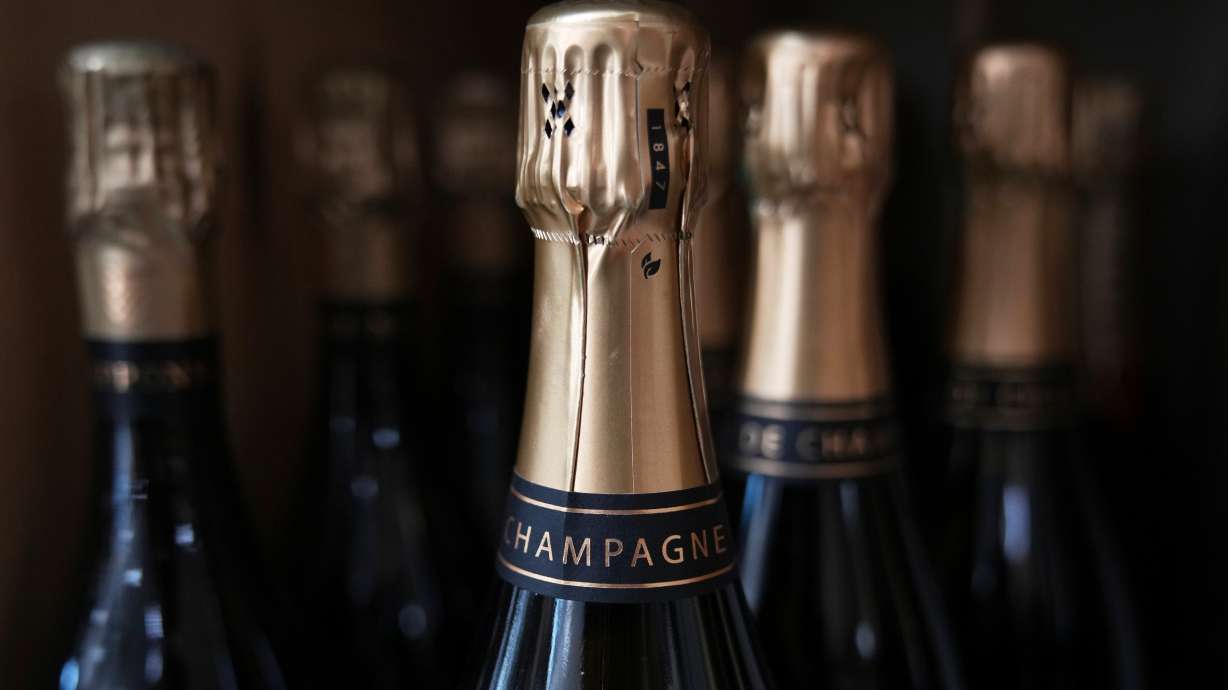 Bottles of Champagne are for sale at a wine dealer shop as President Donald Trump threatened a 200% tariff on European wine, Champagne and spirits if the European Union goes forward with a planned tariff on American whiskey, Thursday in Ville d'Avray, outside Paris.