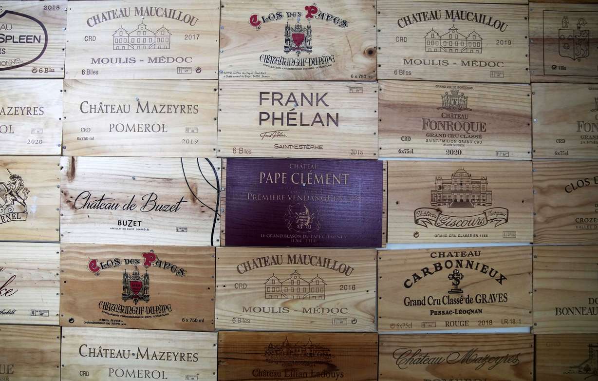 Parts of wine wooden boxes are seen at a wine dealer shop as President Donald Trump threatened a 200% tariff on European wine, Champagne and spirits if the European Union goes forward with a planned tariff on American whiskey, Thursday in Ville d'Avray, outside Paris.