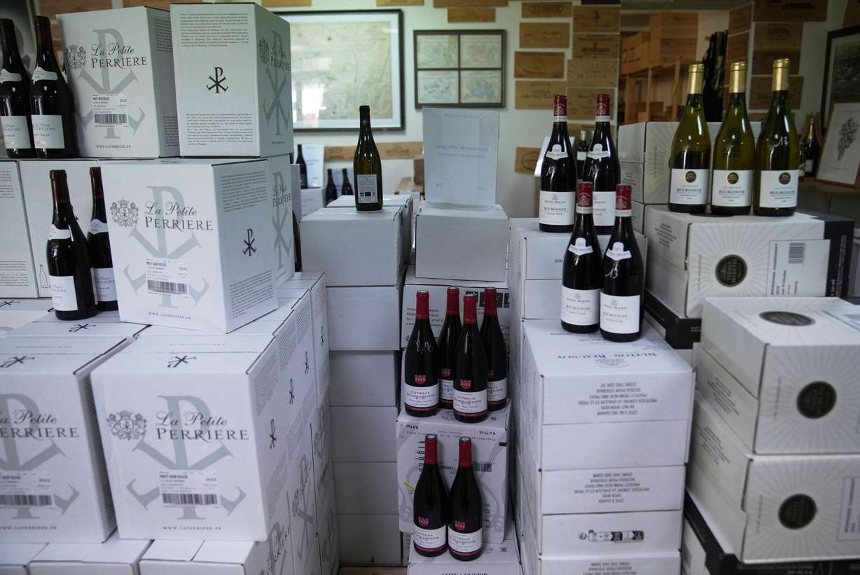 Boxes of wine are for sale at a wine dealer shop as President Donald Trump threatened a 200% tariff on European wine, Champagne and spirits if the European Union goes forward with a planned tariff on American whiskey, Thursday in Ville d'Avray, outside Paris.