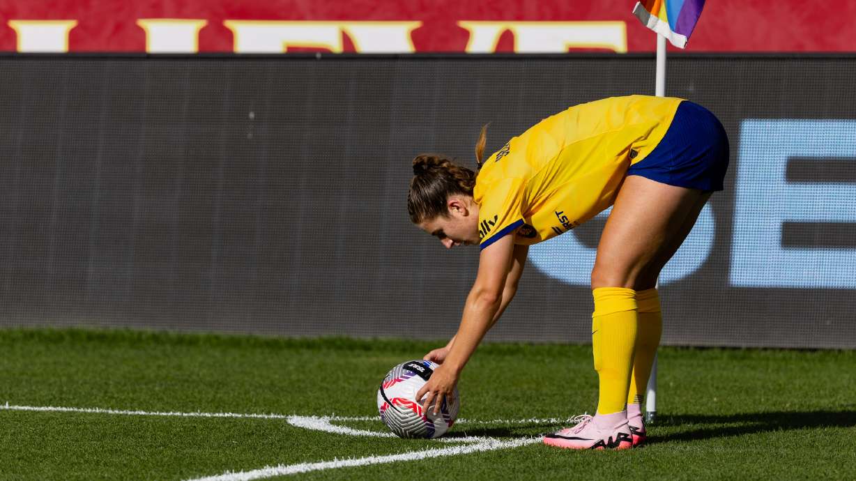 Ally Sentnor sets the ball down before a corner kick at America First Field.