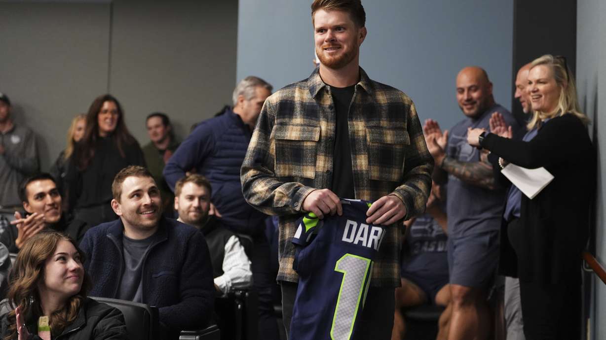 Seattle Seahawks quarterback Sam Darnold arrives for his introductory press conference Thursday, March 13, 2025, at the NFL football team's facilities in Renton, Wash.