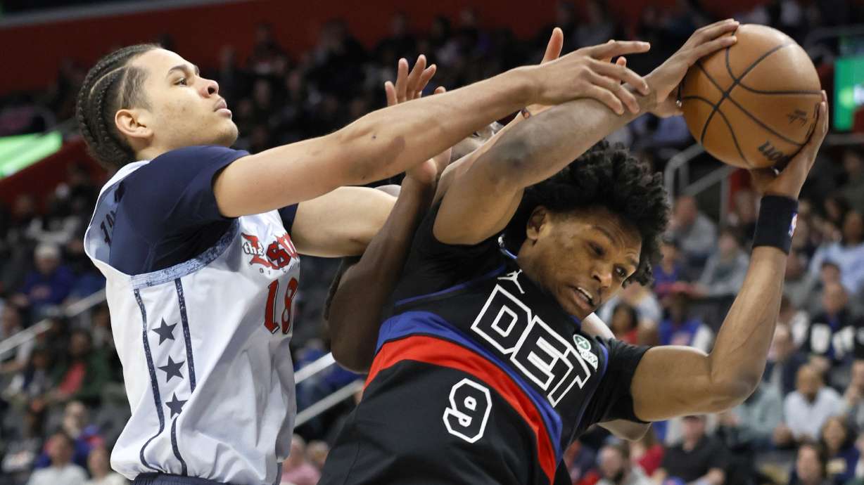 Detroit Pistons forward Ausar Thompson (9) grabs a rebound against Washington Wizards forward Kyshawn George (18) during the first half of an NBA basketball game Thursday, March 13, 2025, in Detroit.