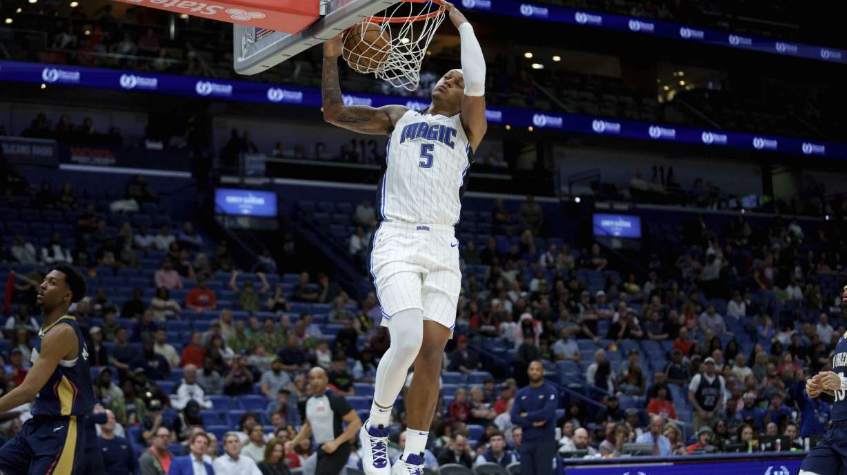Orlando Magic forward Paolo Banchero (5) breaks free for a dunk against New Orleans Pelicans guard Trey Murphy III (25) during the second half of an NBA basketball game in New Orleans, Thursday, March 13, 2025.
