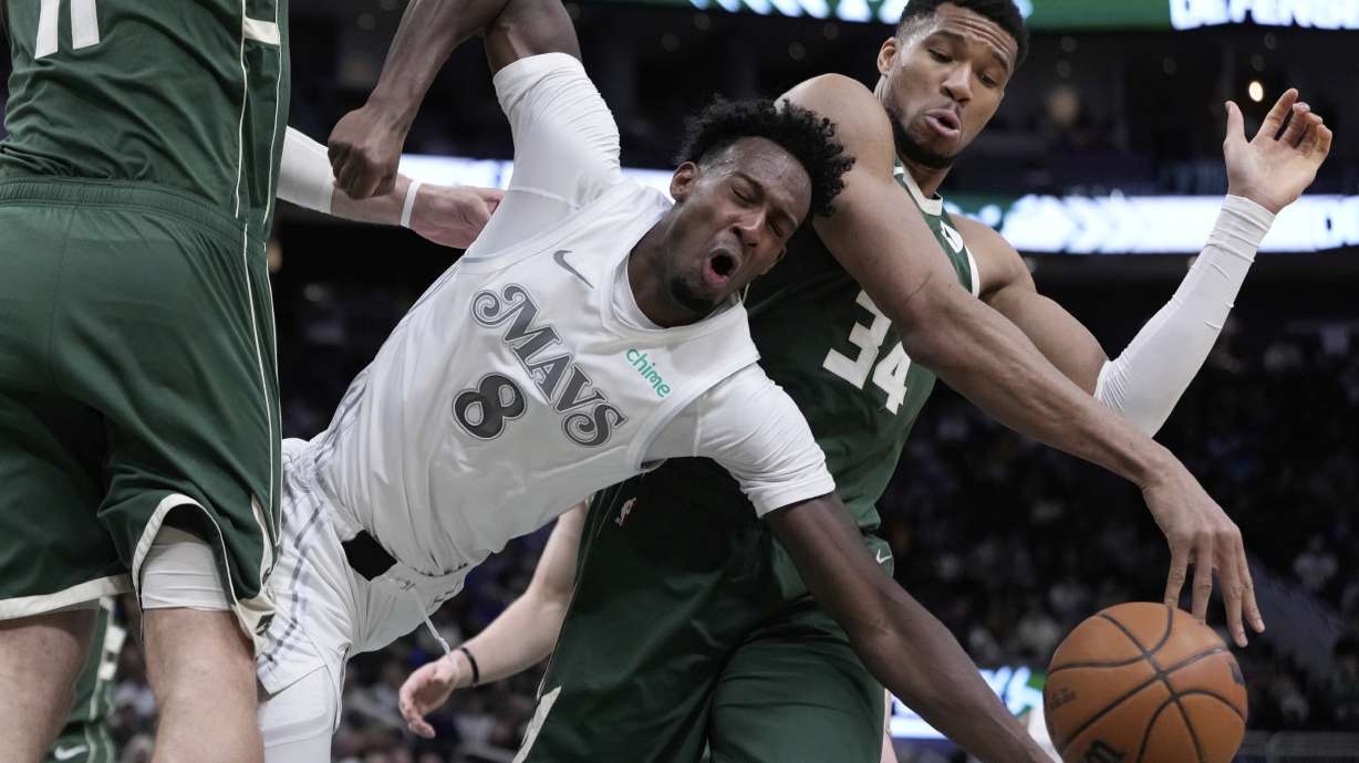 Milwaukee Bucks' Giannis Antetokounmpo fouls Dallas Mavericks' Olivier-Maxence Prosper during the first half of an NBA basketball game Wednesday, March 5, 2025, in Milwaukee.