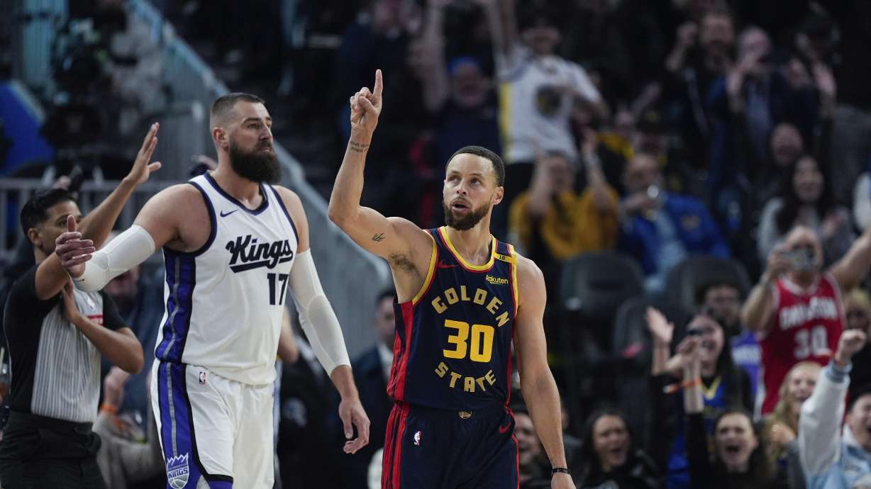 Golden State Warriors guard Stephen Curry (30) reacts after making a 3-point basket during the first half of an NBA basketball game against the Sacramento Kings, Thursday, March 13, 2025, in San Francisco.