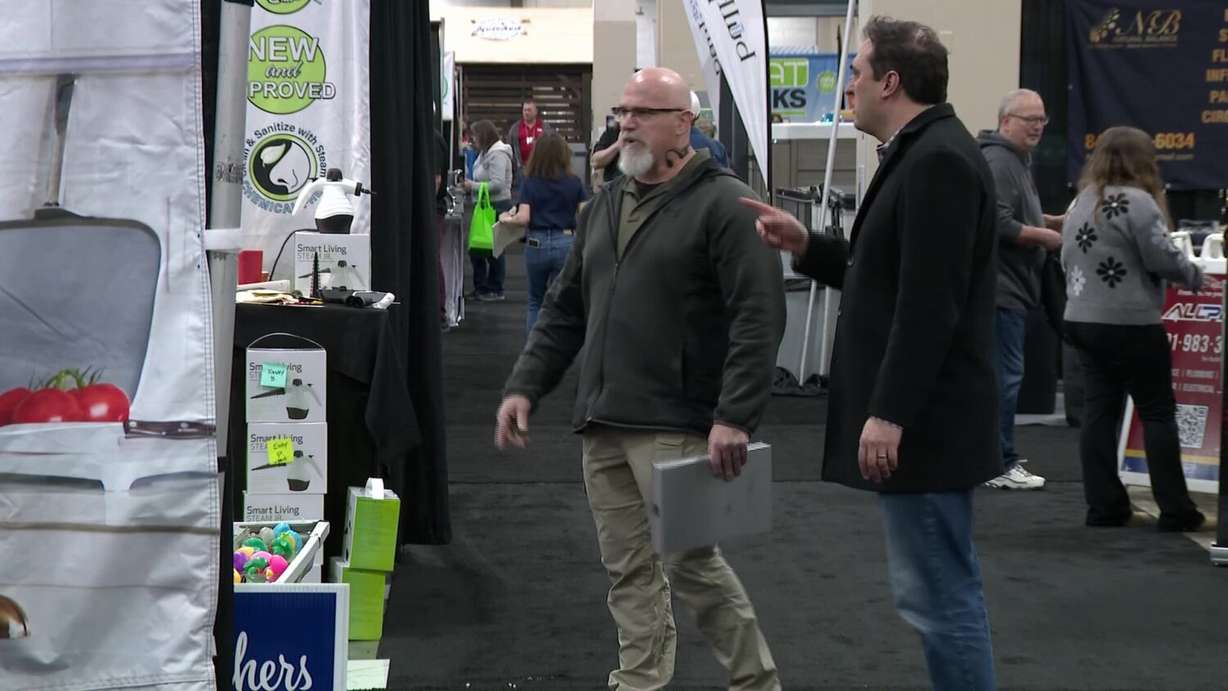 Matt Gephardt and Mike Smith speaking to venders about their licenses.