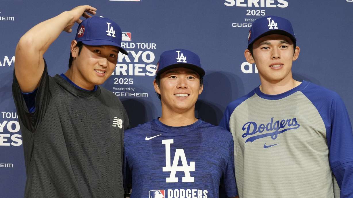 Seiya Suzuki, right, and Shota Imanaga, left, of the Chicago Cubs prepare to pose for photographs after attending the official Press conference Friday, March 14, 2025, in Tokyo, as the Cubs play their MLB opening games against the Los Angeles Dodgers at Tokyo Dome next week.