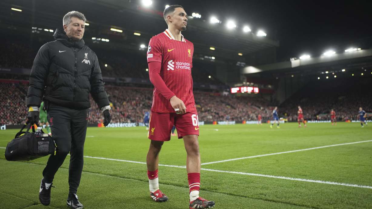 Liverpool's Trent Alexander-Arnold walks off injred during the Champions League round of 16 second leg soccer match between Liverpool and Paris Saint-Germain at Anfield in Liverpool, England, Tuesday, March 11, 2025.