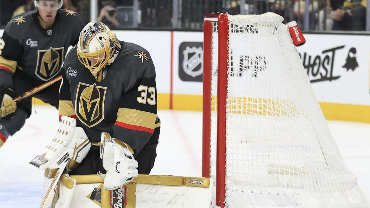 Vegas Golden Knights goaltender Adin Hill (33) makes a save during the first period of an NHL hockey game against the New Jersey Devils, Sunday, March 2, 2025, in Las Vegas.