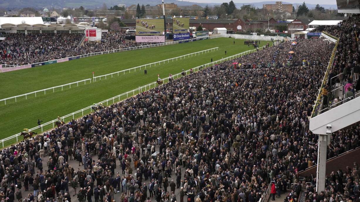 People arrive to watch the final day of the British Horse Racing Cheltenham Festival at Cheltenham Racecourse, England, Friday, March 14, 2025.