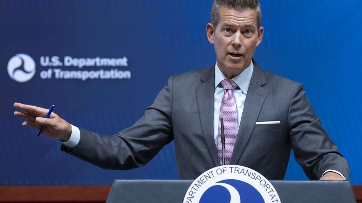 Transportation Secretary Sean Duffy speaks during a news conference following up on the issuance of the preliminary report on the mid-air collision near Ronald Reagan Washington National Airport, Tuesday. The FAA says helicopters will be permanently banned from flying near Washington, D.C.'s airport.