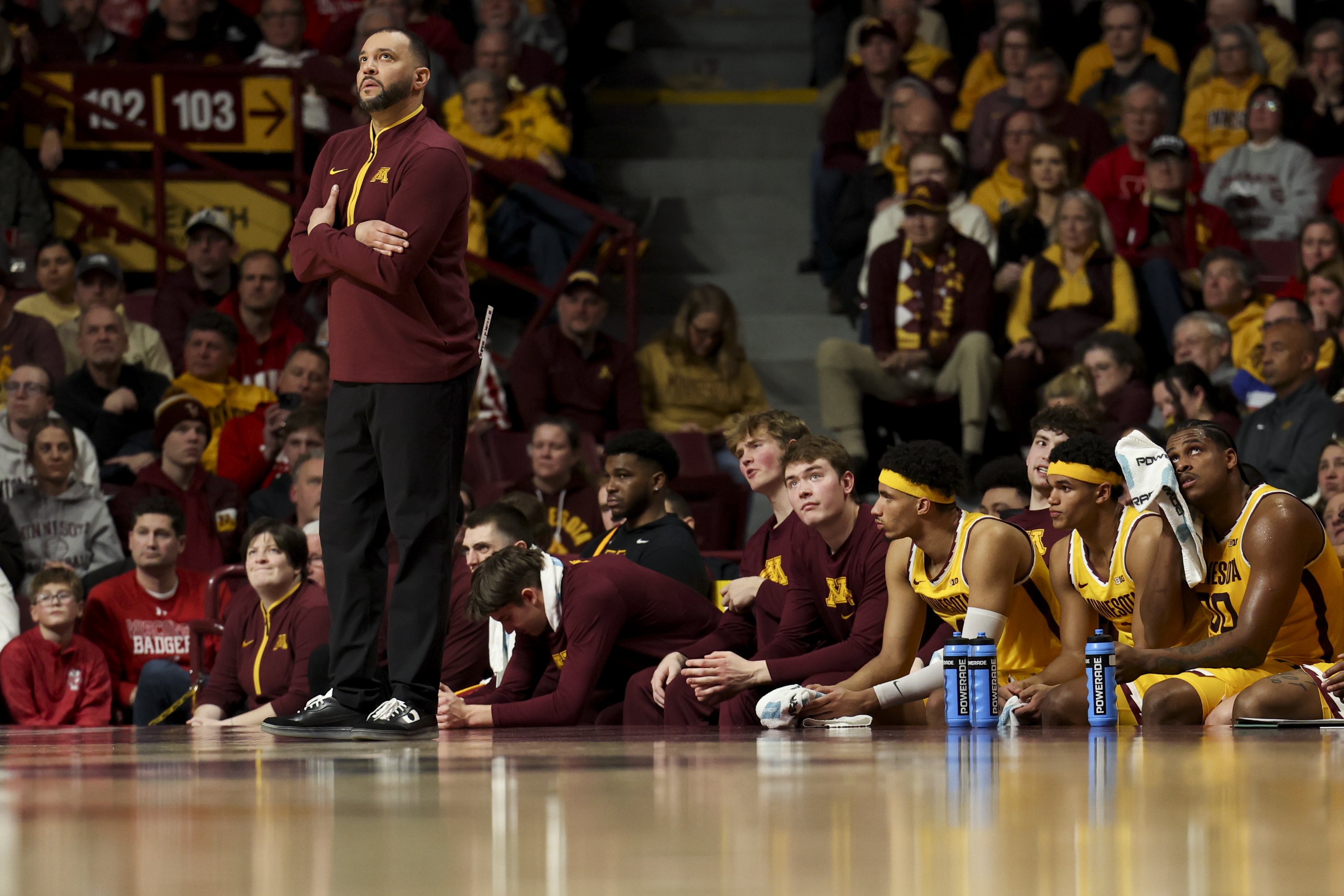 FILE - Minnesota head coach Ben Johnson looks to the scoreboard during the first half of an NCAA college basketball game against Wisconsin, Wednesday, March 5, 2025, in Minneapolis. 