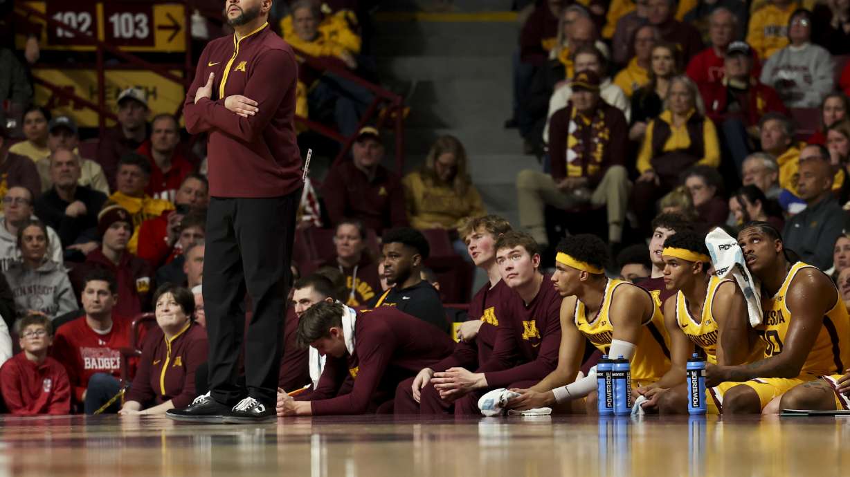 FILE - Minnesota head coach Ben Johnson looks to the scoreboard during the first half of an NCAA college basketball game against Wisconsin, Wednesday, March 5, 2025, in Minneapolis.