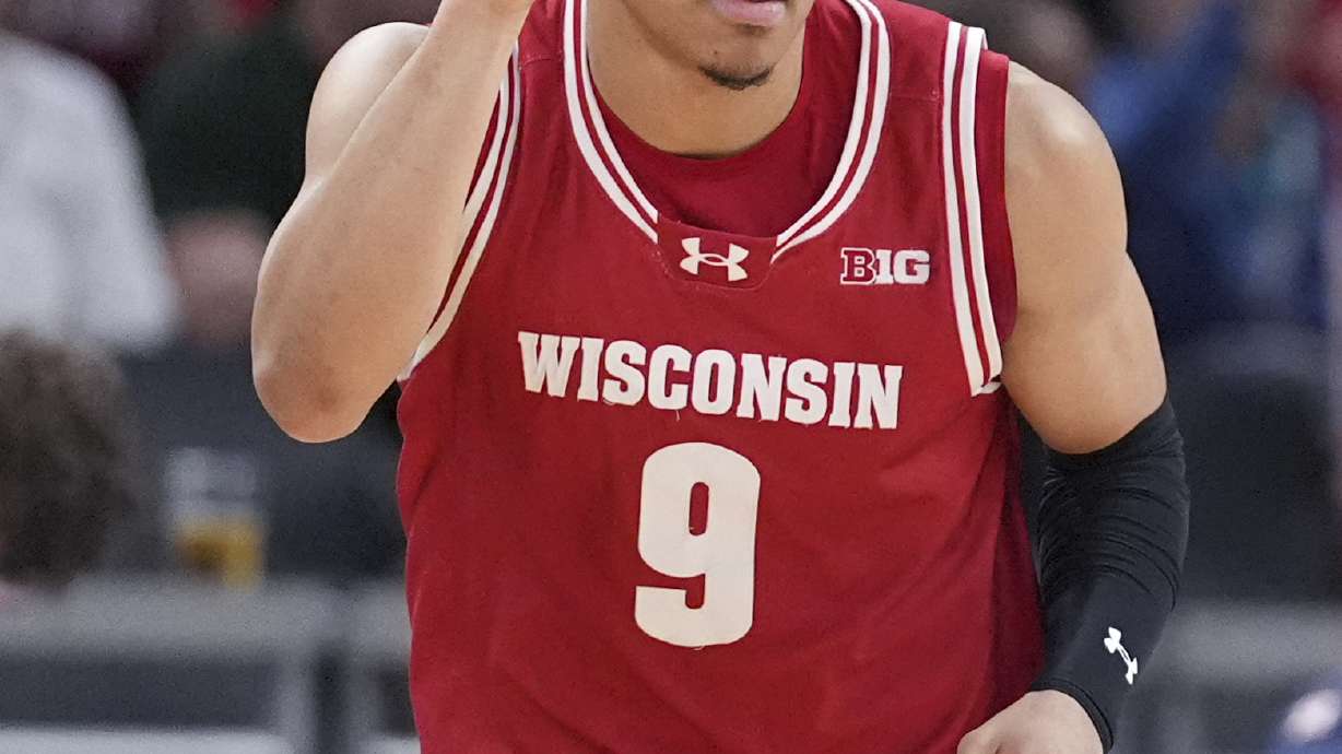 Wisconsin guard John Tonje (9) reacts to a basket against UCLA during the first half of an NCAA college basketball game in the quarterfinals of the Big Ten Conference tournament in Indianapolis, Friday, March 14, 2025.