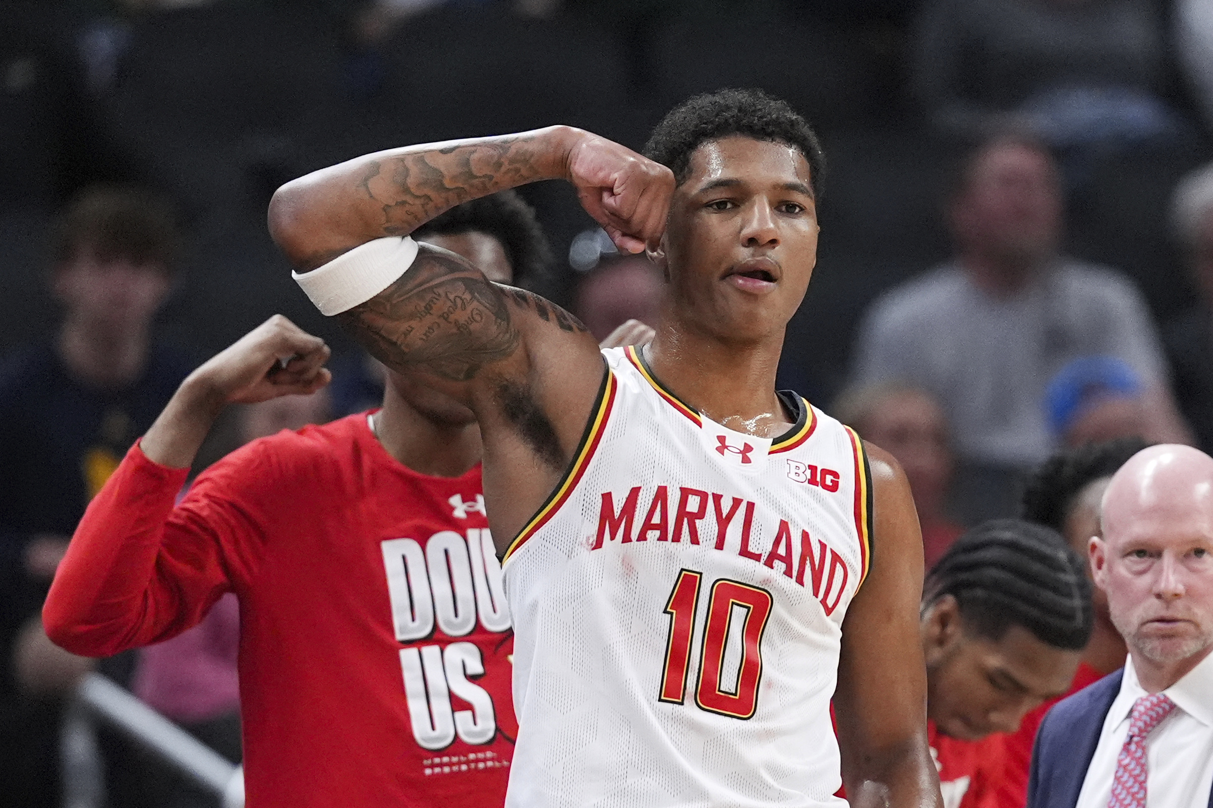 Maryland forward Julian Reese (10) flexes on the bench against Illinois during the first half of an NCAA college basketball game in the quarterfinals of the Big Ten Conference tournament in Indianapolis, Friday, March 14, 2025.
