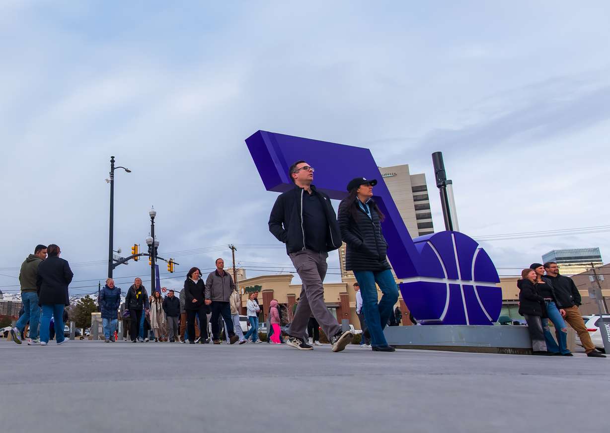 Basketball fans file into Delta Center before a game between the Utah Jazz and Toronto Raptors on Friday.