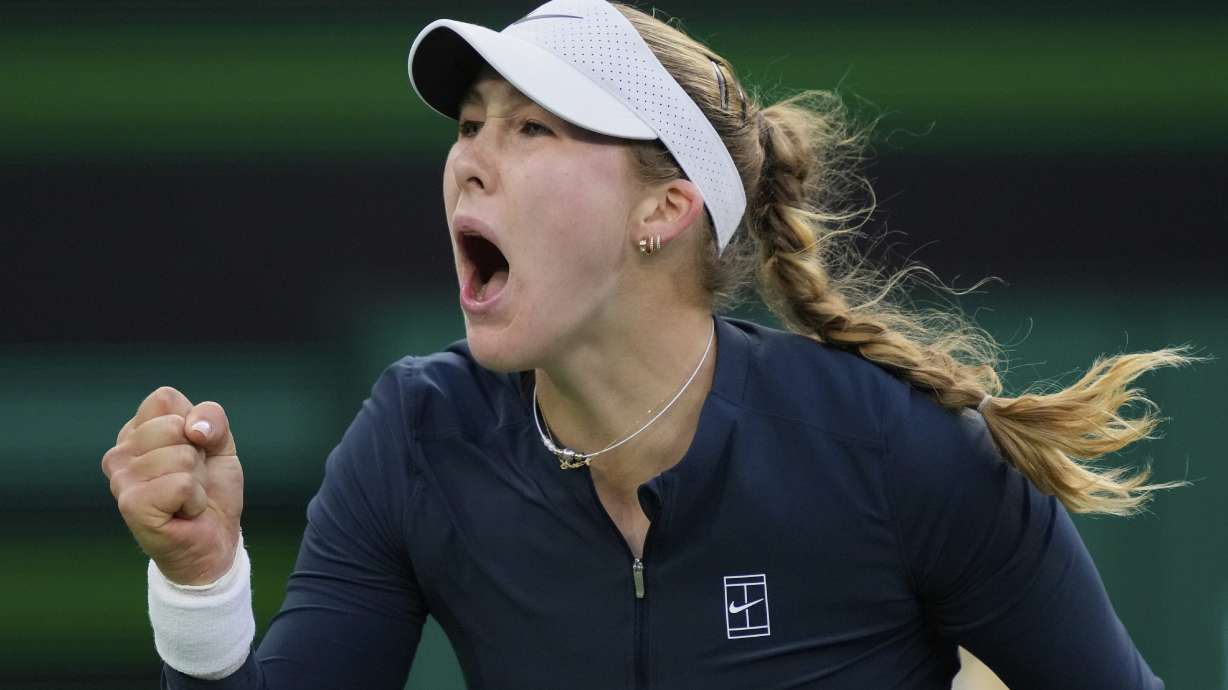 Mirra Andreeva, of Russia, celebrates winning a point against Iga Swiatek, of Poland, during the semifinals at the BNP Paribas Open tennis tournament Friday, March 14, 2025, in Indian Wells, Calif.
