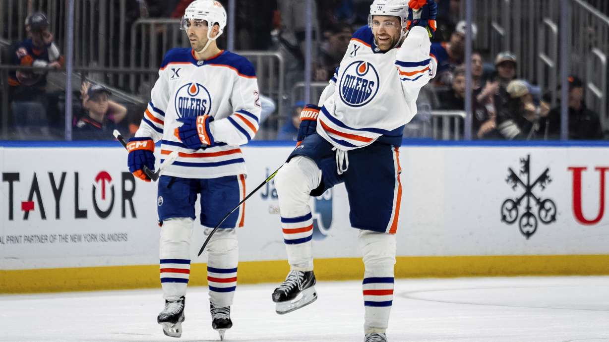 Edmonton Oilers center Leon Draisaitl (29) celebrates scoring the winning goal in overtime of an NHL hockey game against the New York Islanders, Friday, March 14, 2025, in Elmont, N.Y.