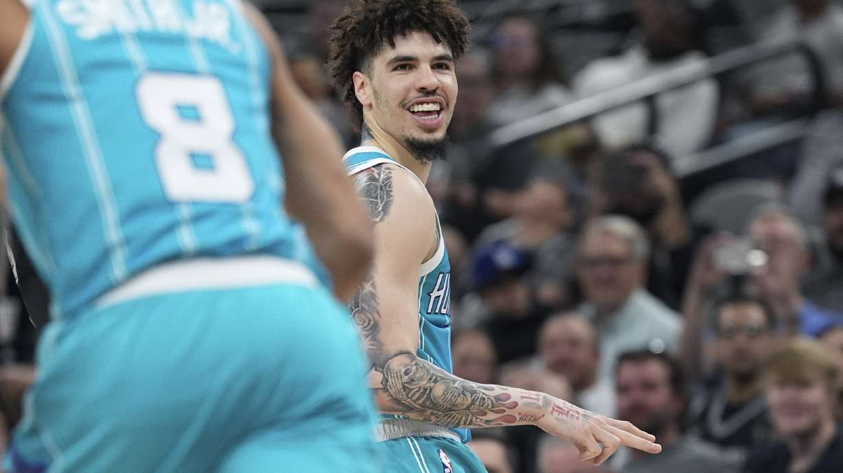 Charlotte Hornets guard LaMelo Ball (1) reacts to a score against the San Antonio Spurs during the second half of an NBA basketball game in San Antonio, Friday, March 14, 2025.