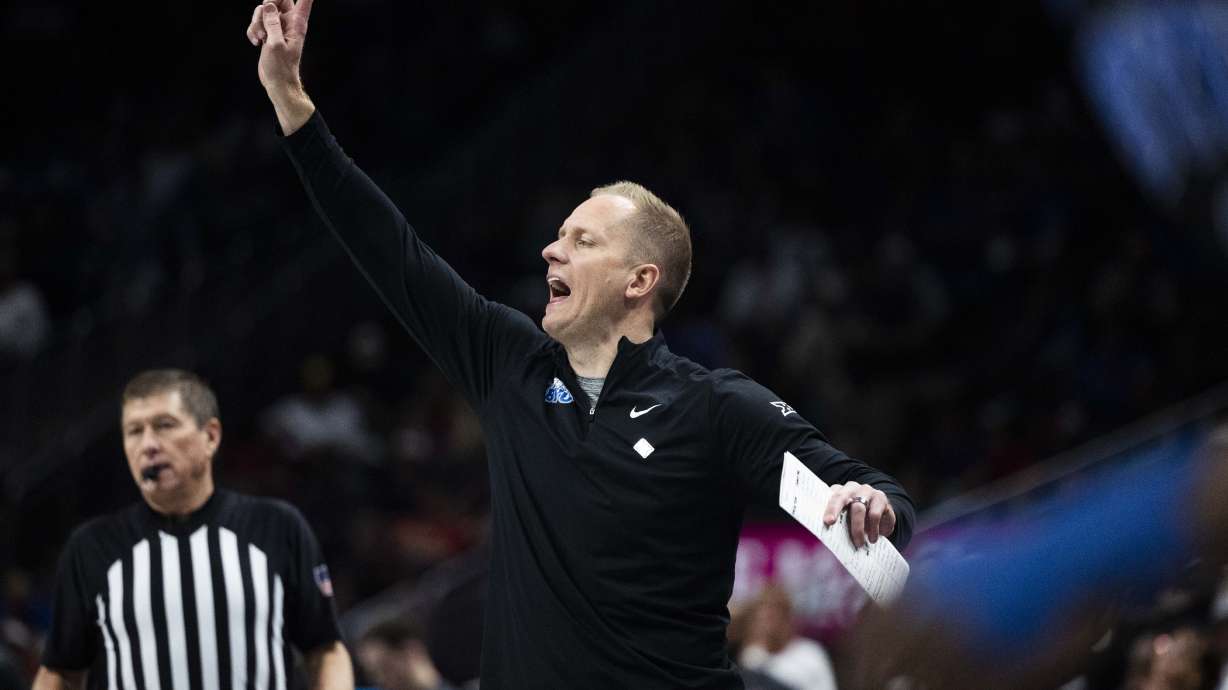 Brigham Young head coach Kevin Young yells to his players from the sidelines during a Big 12 Championship semifinal game between BYU and the Houston Cougars at the T-Mobile Center in Kansas City, Missouri, on Friday, March 14, 2025. The Houston Cougars claimed victory over BYU with a final score of 74-54, knocking BYU out of the Big 12 Championship.