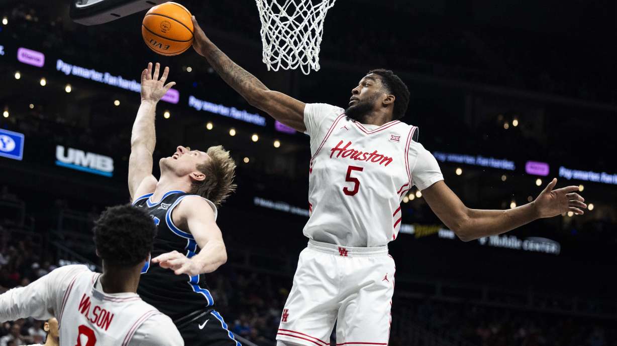 Houston Cougars forward Ja'Vier Francis (5) blocks a shot by Brigham Young Cougars guard Dawson Baker (25) during a Big 12 Championship semifinal game at the T-Mobile Center in Kansas City, Missouri, on Friday, March 14, 2025. The Houston Cougars claimed victory over BYU with a final score of 74-54, knocking BYU out of the Big 12 Championship.