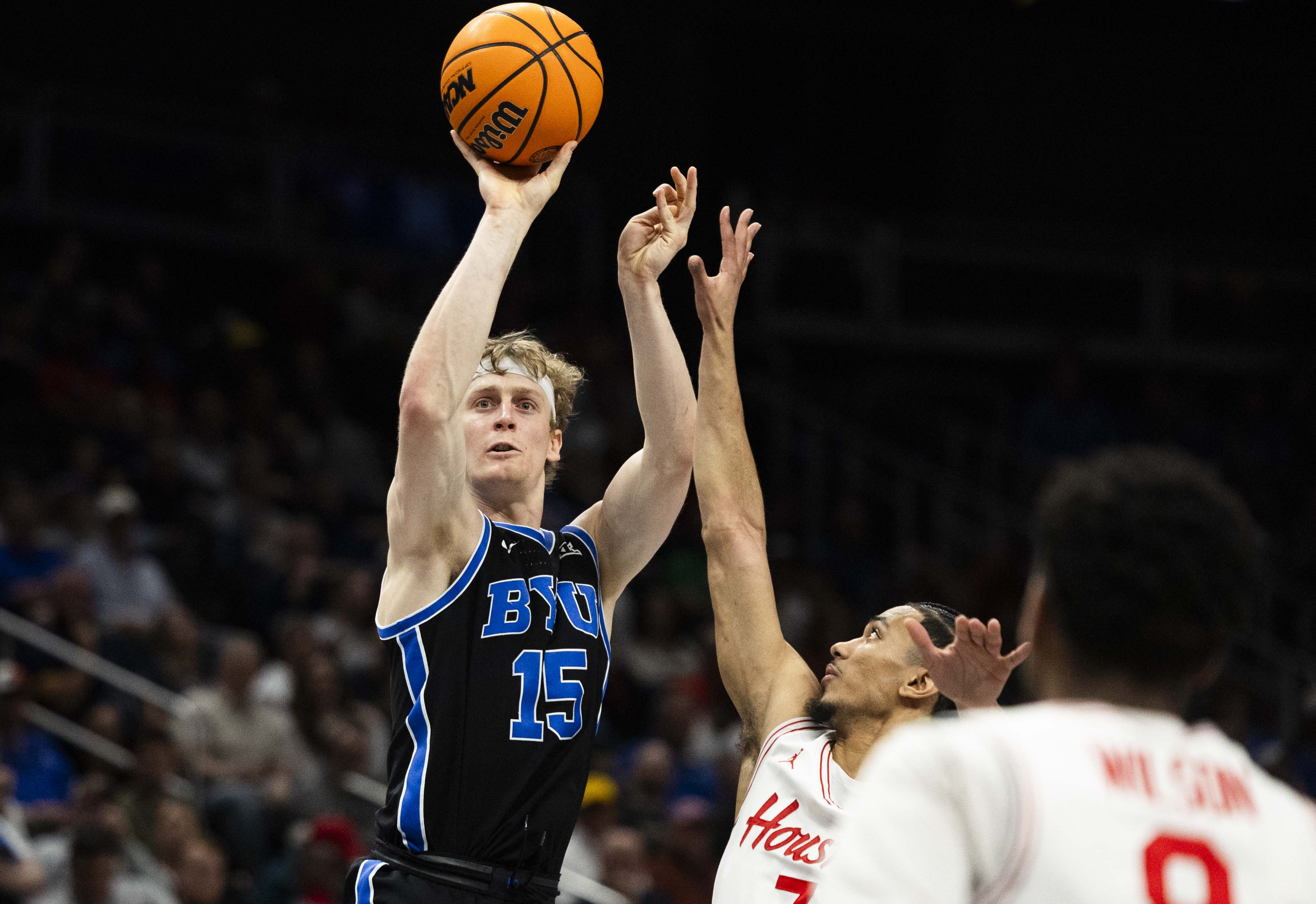 Brigham Young forward Richie Saunders (15) puts up a 3-pointer during a Big 12 Championship semifinal game between BYU and the Houston Cougars at the T-Mobile Center in Kansas City, Missouri, on Friday, March 14, 2025. The Houston Cougars claimed victory over BYU with a final score of 74-54, knocking BYU out of the Big 12 Championship.